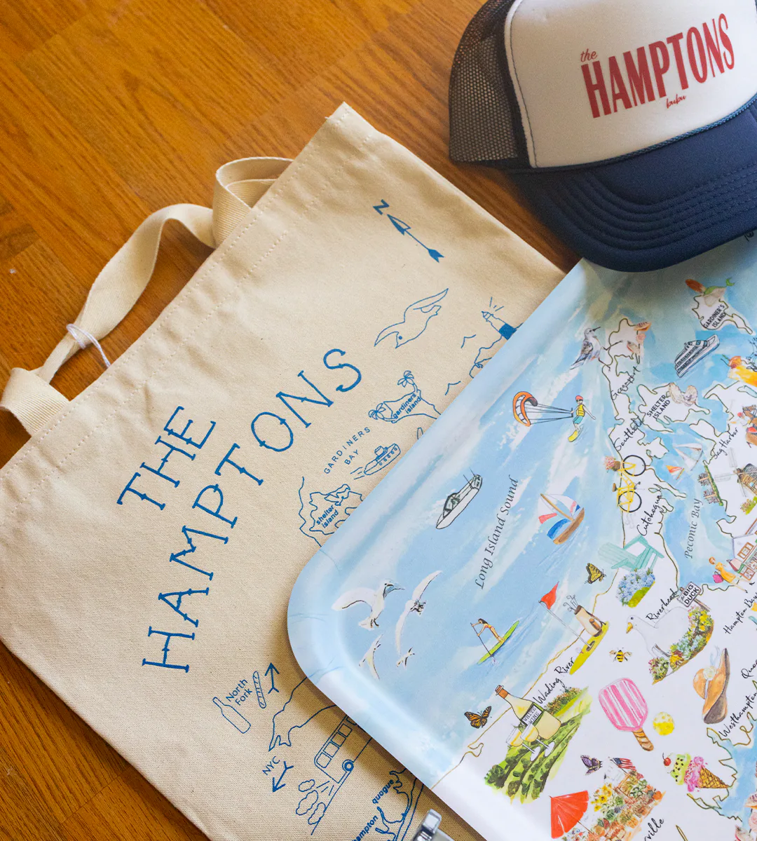 A “The Hamptons” canvas tote, a “The Hamptons” trucker hat and an illustrated map tray of the East End, from Hildreth’s in Southampton