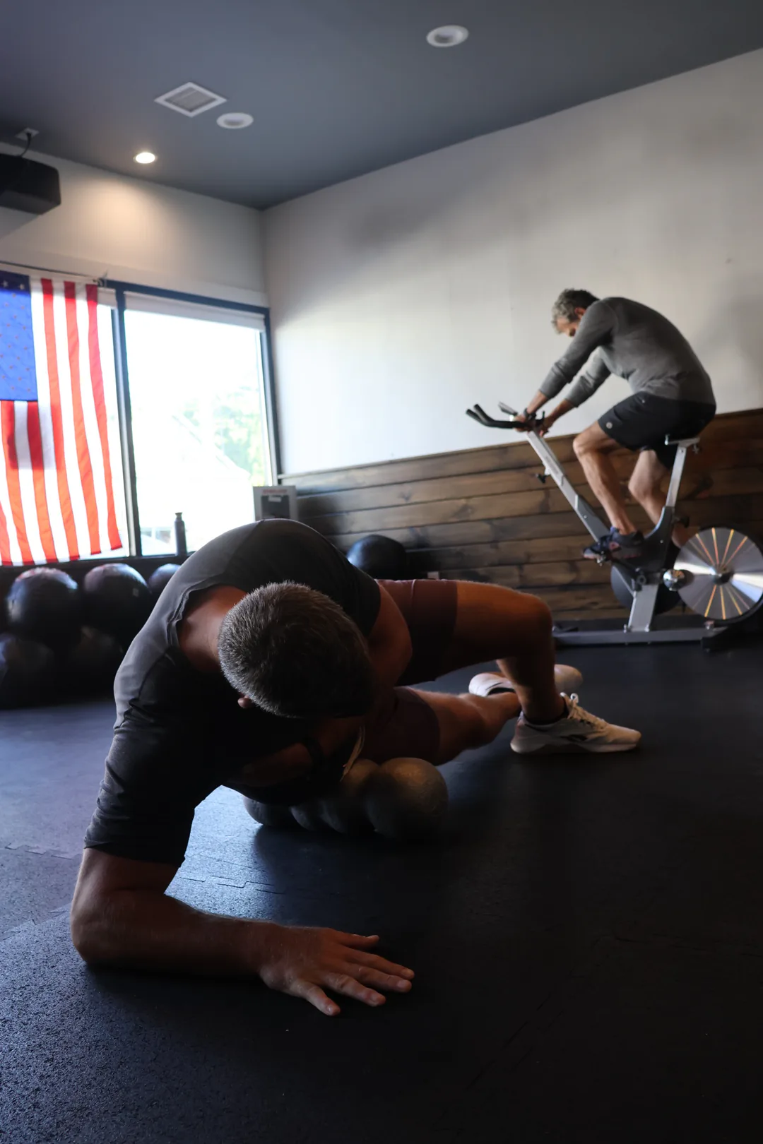 Mobility training on the gym floor at Nomad East Fitness, East Quogue
