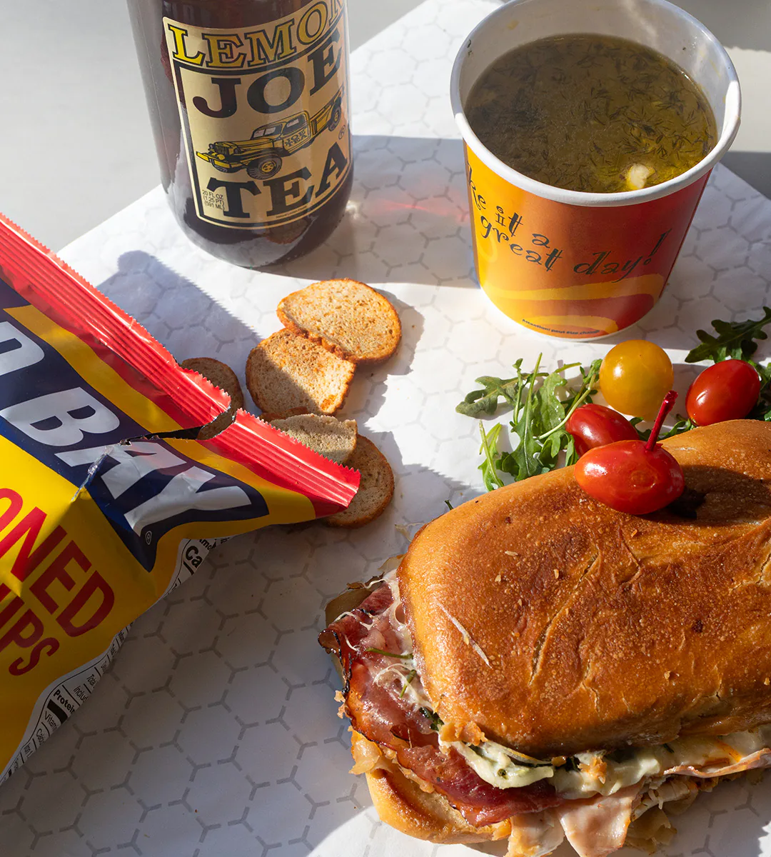 A lunch special from Schmidt’s Country Market in Quogue, Long Island: a sandwich on a brioche roll with chips, soup and iced tea